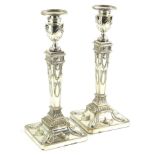 A pair of silver plated candlesticks, modelled in neo classical style, in the manner of Robert Adam,