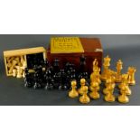 A Staunton turned and carved box wood and part ebonised chess set, each piece stamped with a crown