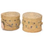 A pair of Indian rattan cases, each with a loop handle, 63cm diameter.