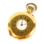 A late 19thC ladies half hunter pocket watch, bezel wind, in a yellow metal case stamped 18K.