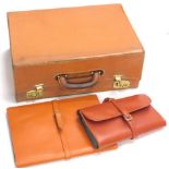 Various leather document holders, a leather suitcase, etc., (a quantity).