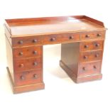 A Victorian mahogany Holland and Sons desk, with a raised gallery and a moulded edge above an