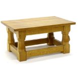 Robert Mouseman Thompson. A small oak coffee table, the rectangular adzed top on champhered