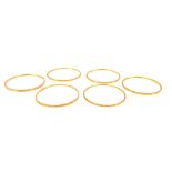 A set of six circular bangles, with chased decoration, unhallmarked yellow metal.