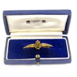 A RAF bar brooch, with the RAF symbol, in green and red enamel decoration, with bi-colour wings,