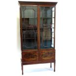 An Edwardian mahogany display cabinet, the top with a Greek key moulded cornice with two astragal