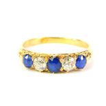 A sapphire and diamond five stone ring, set in unmarked yellow metal, 3.7g all in.