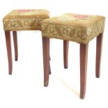 A pair of 19thC mahogany stools, each with a padded wool work seat on splayed legs, 33cm wide.