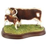 A Border Fine Arts figure group, modelled in the form of two Longhorn cattle, painted by L Conroy,