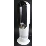 A Dyson hot and cold heater and fan, 60cm high, with remote control.