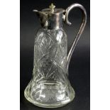 An early 20thC cut glass claret jug, with plated mounts and 'S' scroll handle, the bell shaped