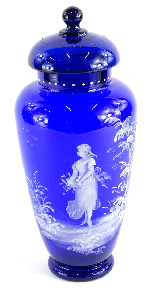 An early 20thC Bristol blue type Mary Gregory design jar and cover, with a dot decoration, set