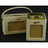 Two cream Roberts portable radios.