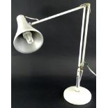 A cream enamel painted Anglepoise lamp, stamped to the base Made in England by Herbert Terry &