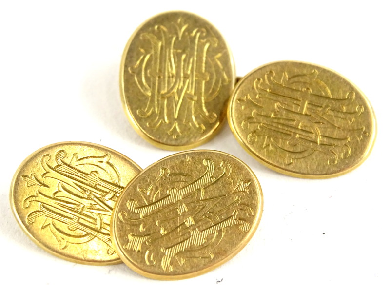 A pair of oval cufflinks, bearing the inscription HMW to each side, yellow metal, unmarked, marked