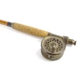 A miniature split cane vintage fishing rod, with brass mounts and reel, 97cm long.