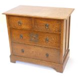 A 1920s oak chest of drawers, the top with moulded edge with two short and three long drawers,