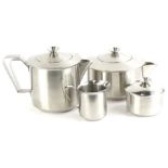 A Danish mid century stainless steel four piece tea set, of tapering form with shaped handles,