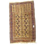 A Turkomen type rug, with an all over geometric design of triangles, roundels and stylised leaves,