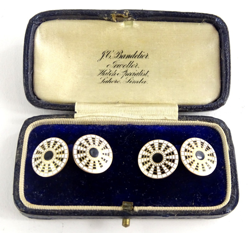 A pair of 9ct gold circular cufflinks, with black and white enamel design, markers stamp W.M & Co,