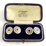 A pair of 9ct gold circular cufflinks, with black and white enamel design, markers stamp W.M & Co,