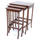 A nest of three Edwardian tables, each with a rectangular top on splayed legs, the largest 44cm