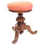 A Victorian rosewood adjustable piano stool, the circular padded top with spindle attached, with a