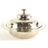 An Arts and Crafts silver plated muffin dish, with overall hammered decoration, makers stamp to