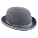 A gentleman's bowler hat, with fabric rim, indistinct gilt makers stamp to inside, 29cm long, 23cm