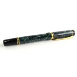 A Parker Duofold fountain pen, with green simulated marble effect and black, silver plated bands,