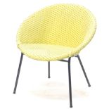 A Lloyd Loom chair, yellow painted cane, on an ebonised metal base.