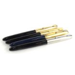 Four Parker 61 fountain pens, three in black, one navy, the navy example with blue enamel to the