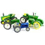 Four Danbury Mint novelty tractor clocks, each from the John Deere Clocks Collection, limited