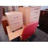 A modern office desk, a matching chest of five drawers, a two drawer filing cabinet and a chair (