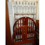 An Edwardian mahogany and inlaid single bed of arched form, with satinwood oval panel to the