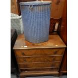 A small walnut chest of four drawers in George III style on bracket feet and a blue Loom linen