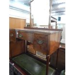 An early 20thC mahogany dressing table, with shaped arched mirror, the top with a bowed centre above