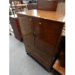 A mid 20thC walnut tallboy, with two cupboard doors above two drawers, on short cabriole legs.