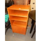 A narrow G-Plan type teak retro side cabinet with adjustable shelves and a door.