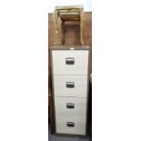 A modern four drawer metal filing cabinet and a nest of two brass and onyx tables.