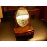 A late 19th/early 20thC mahogany dressing table mirror, the oval plate on shaped supports, the bow