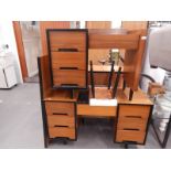 A walnut and ebonised mid-century retro bedroom suite, comprising two dressing tables, a