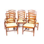 A set of eight Reprodux mahogany Georgian style ladder back dining chairs, with drop in seats,