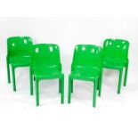 A set of four Vico Magistretti designed green plastic stacking chairs.