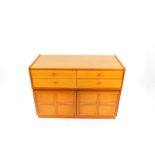 A Nathan teak cupboard chest, of four drawers over a pair of cupboard doors, raised on a plinth