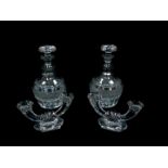 A pair of cut glass decanters and stoppers, 25cm high, together with a pair of Val St Lambert twin