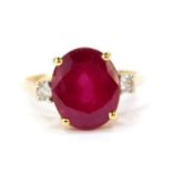 A 9ct gold Madagascan ruby and zircon ring, the oval cut ruby 6.35cts, size N/O, 2.24g gold, with