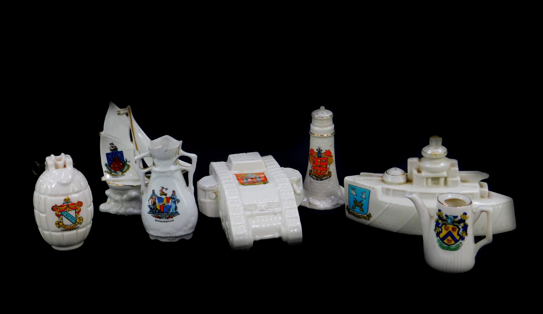 Crested china, comprising a Grafton battleship, Arms of Paddington., WWI tank, Arms of Redhill.,