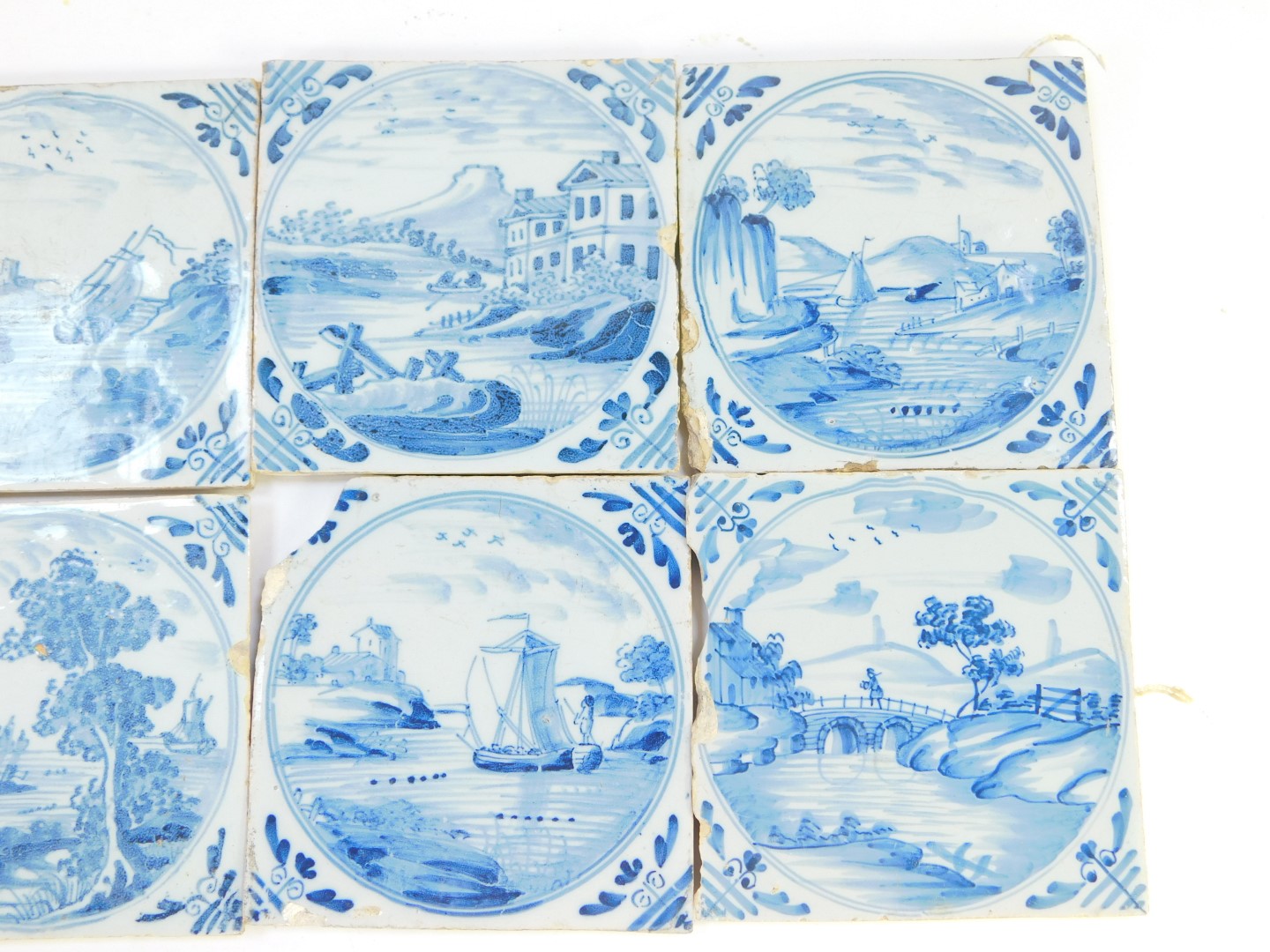 Eight 18thC Dutch delftware tiles, decorated with landscapes and riverscapes within circular - Image 3 of 4