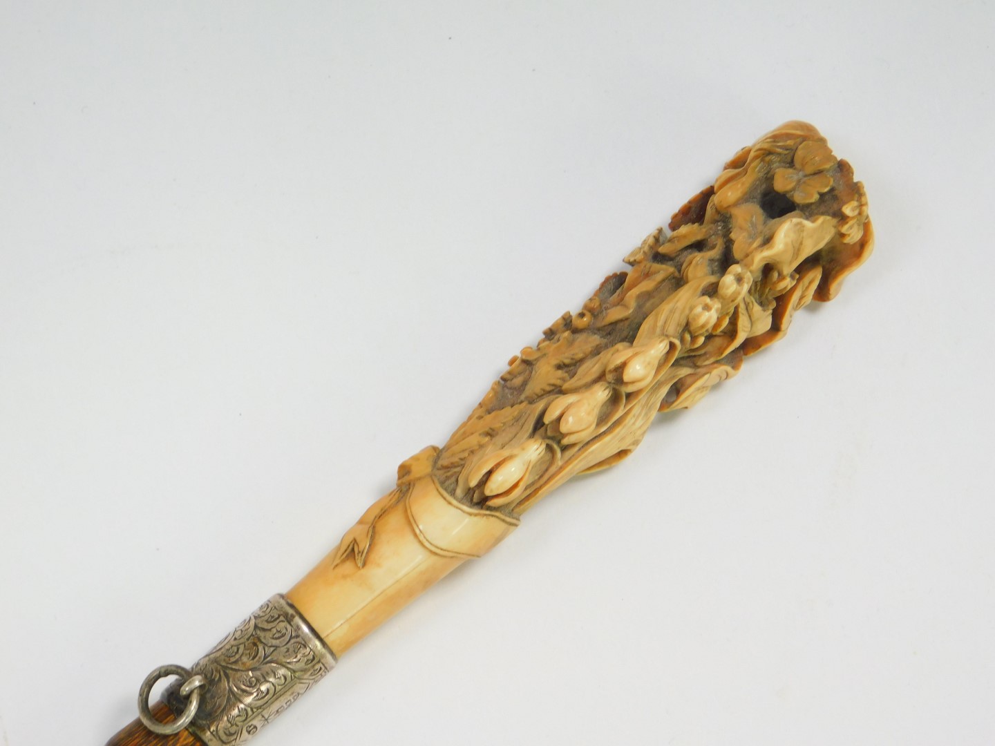 A Victorian lady's partridge wood walking cane, with an ivory handle carved with flowers and leaves, - Image 2 of 4